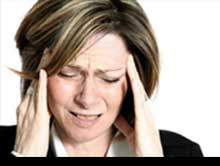 Man experiencing a headache with pressure points