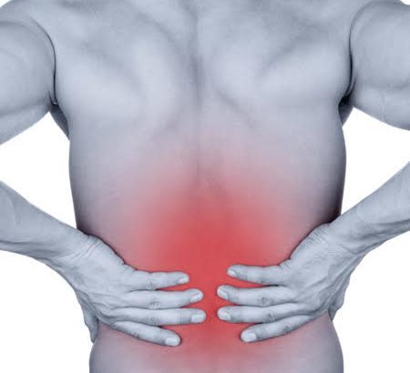 Person experiencing severe back pain